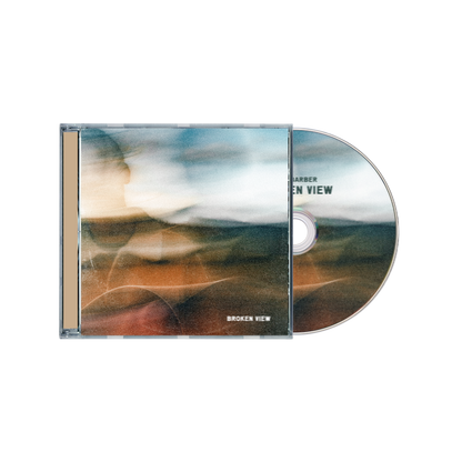 CD with cover featuring a landscape design